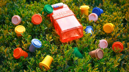 Ivy Brews coffee sachets at a spring picnic scene with recyclable packaging and wooden utensils